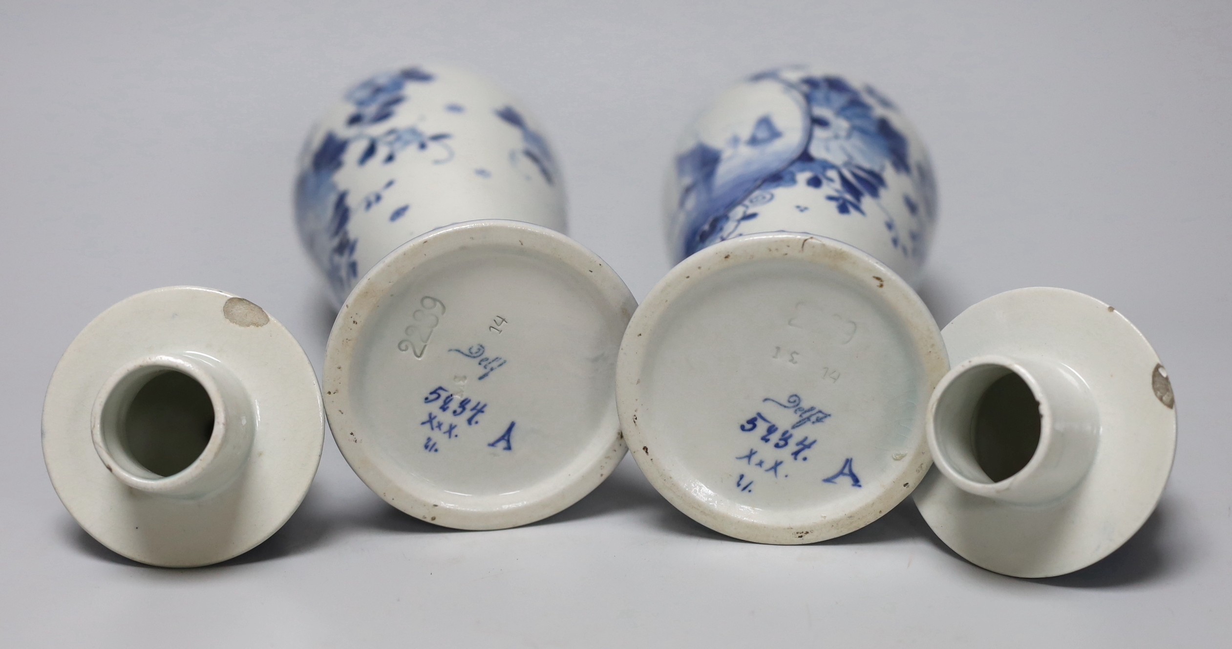A pair of blue and white Delft vases and covers, 28cm
